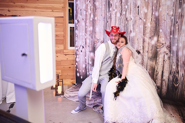 Bride and groom using an Open Air Photo Booth