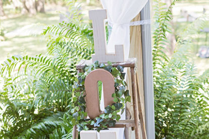 wooden letters spelling LOVE on a rustic ladder - wedding decor