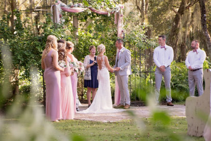 bride, groom, officiant and bridal party at an outdoor wedding ceremony in Arcadia, FL