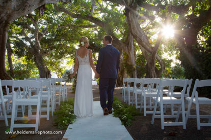 bride and groom walking under a canopy of Banyan trees on Boca Grande Florida
