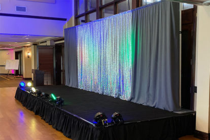 drap backdrop for a stage at a wedding reception