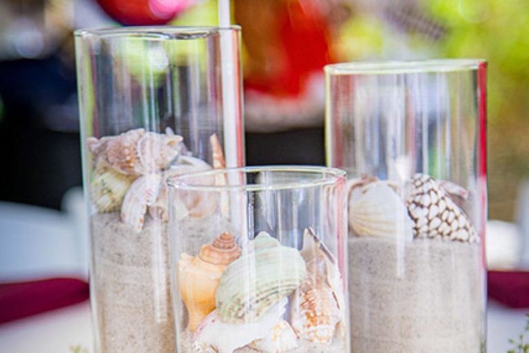 vases filled with sand and shells