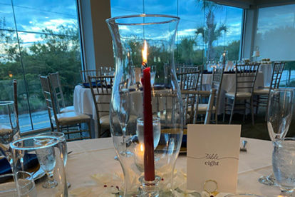 red candle centerpiece at wedding reception