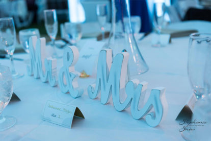 wooden Mr. & Mrs. sign at a wedding reception