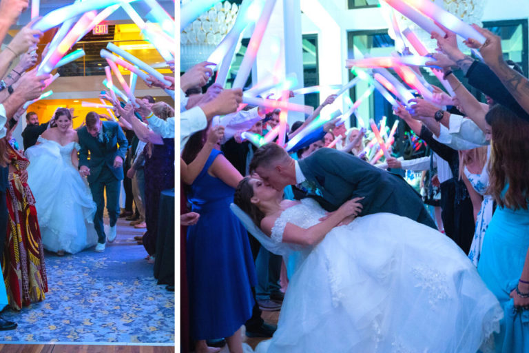 bride and groom exiting their reception through a tunnel of colored foam sticks held by guests