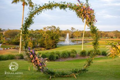 circular arbor decorated with flowers and vines