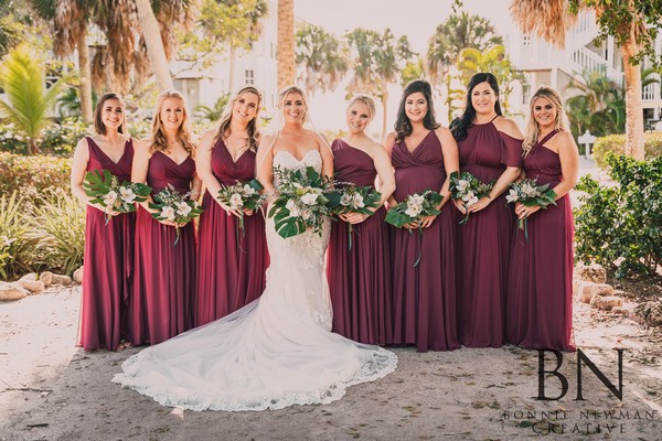 bride with bridesmaids in maroon dresses at Palm Island Wedding