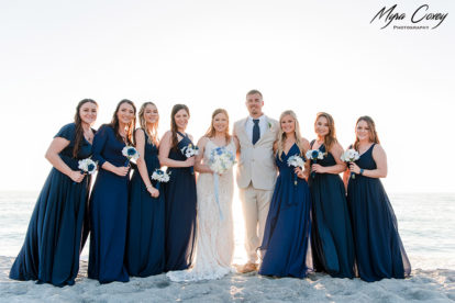 bride and groom with wedding party on the beach in Venice, Florida
