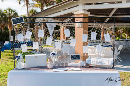 welcome table at a wedding reception decorated in a nautical theme