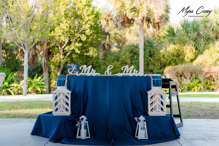 head table at a nautical themed outdoor wedding reception