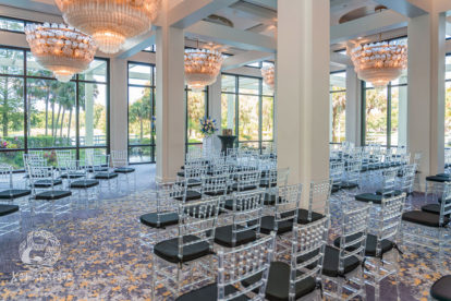ceremony site inside a resort hotel with floor to ceiling windows