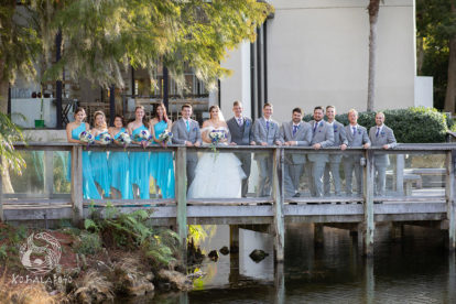 bridesmaids and groomsmen standing on a bridge at the Hyatt Regency in Orlando Florida