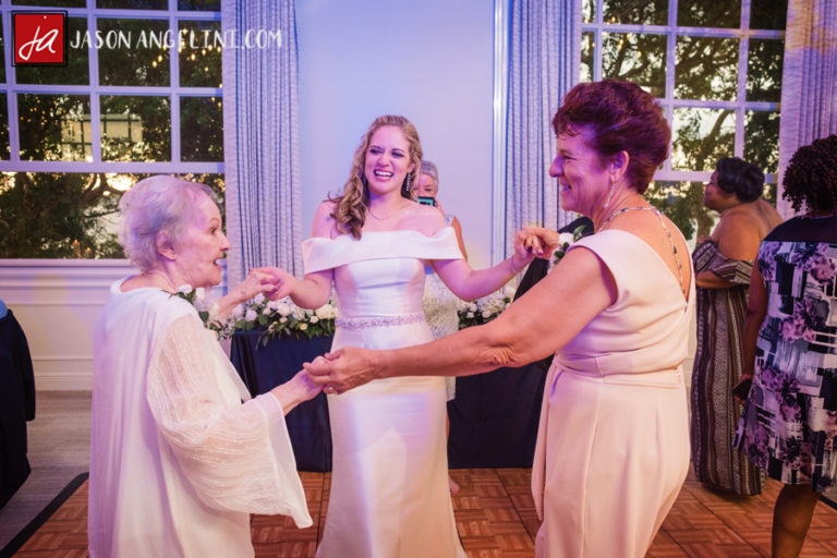 bride, her mother, and her grandmother dancing at the reception