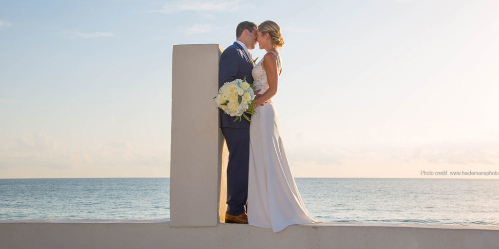 bride and groom with ocean in the background - Boca Grande Florida wedding planner