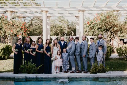 bridal party in front of pergola at Historic Spanish Point