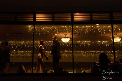 Venice Yacht Club Wedding - banquet hall illuminated at night photographed through the window