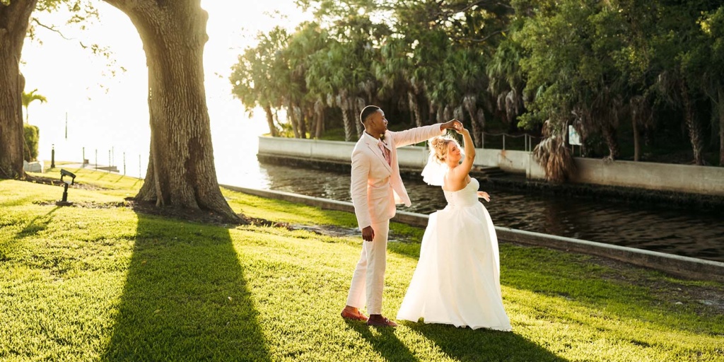 bride and groom dancing on the lawn at the Powel Crosley Estate in Sarasota, FL